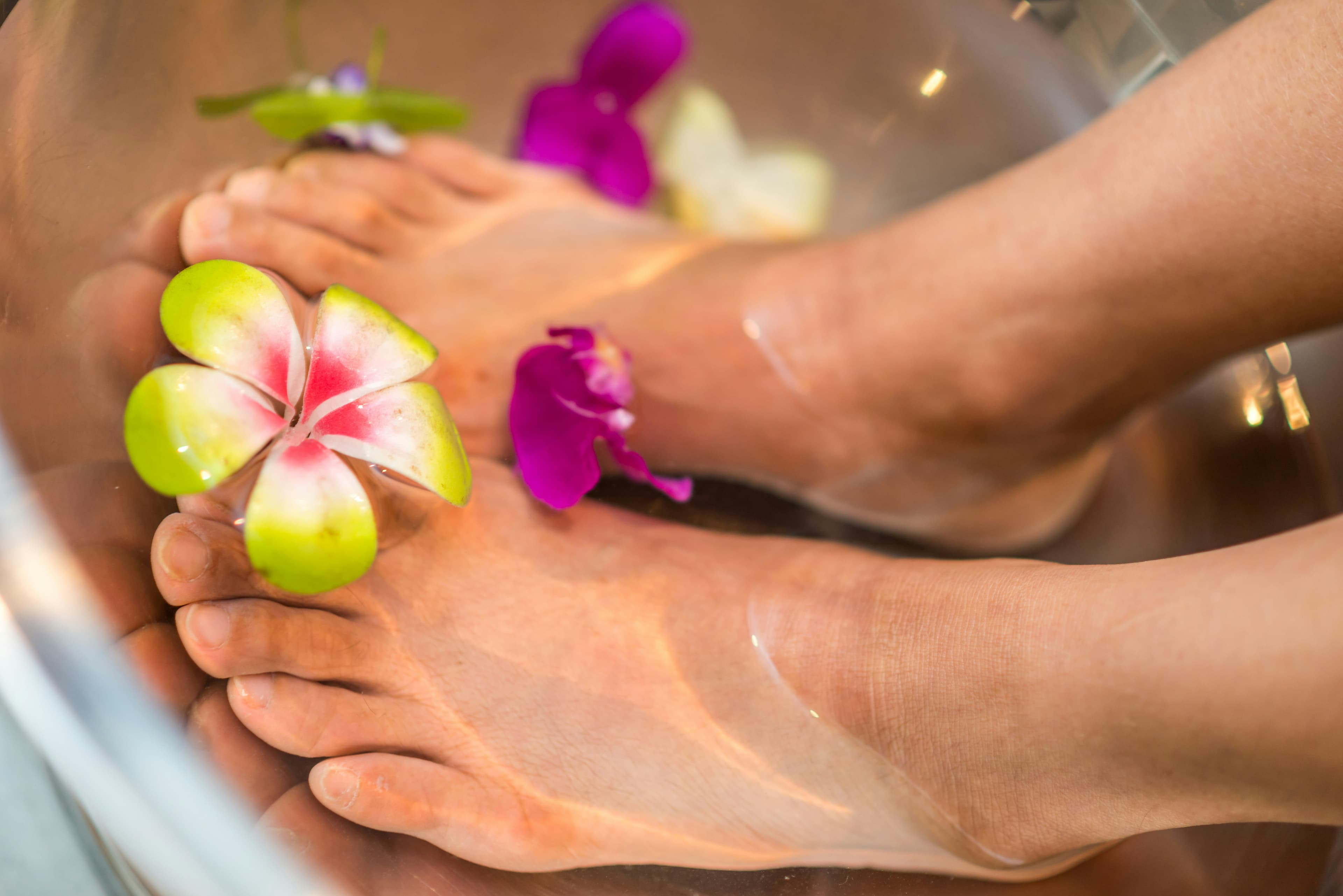 Professional pedicure treatment with polished toenails